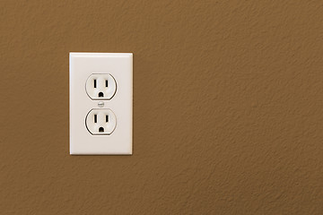 Image showing Electrical Sockets In Colorful Brown Wall