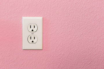 Image showing Electrical Sockets In Colorful Pink Wall