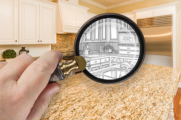 Image showing Hand Holding Magnifying Glass Revealing Custom Kitchen Design Dr