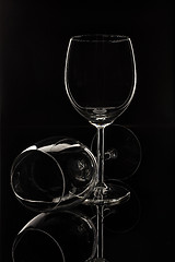 Image showing Wineglasses On A Black Glass Studio Background