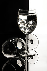Image showing Wineglasses On A Black Glass Studio Background
