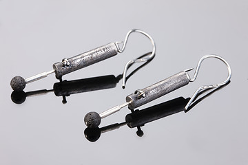 Image showing Handmade jewelry on a black glass