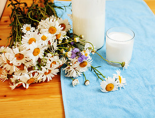 Image showing Simply stylish wooden kitchen with bottle of milk and glass on t