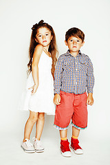 Image showing little cute boy and girl hugging playing on white background, ha