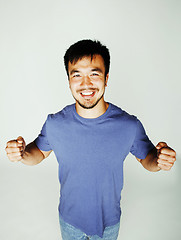 Image showing young cute asian man on white background gesturing emotional, posing lifestyle people concept