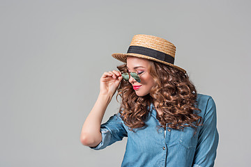 Image showing girl in sunglasses and straw