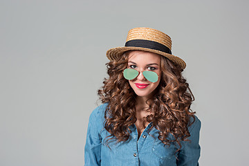 Image showing girl in sunglasses and straw