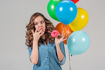 Image showing girl with bunch of colorful balloons