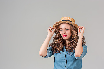 Image showing The girl in straw hat