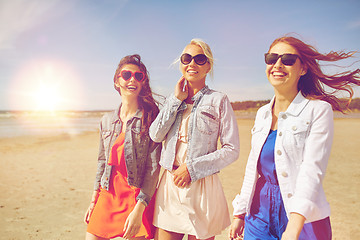 Image showing group of smiling women in sunglasses on beach