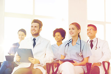 Image showing group of happy doctors on seminar at hospital