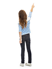Image showing girl pointing finger at something invisible