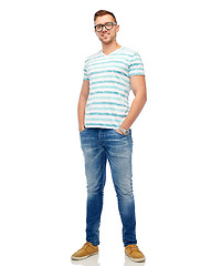 Image showing smiling young man in eyeglasses over white