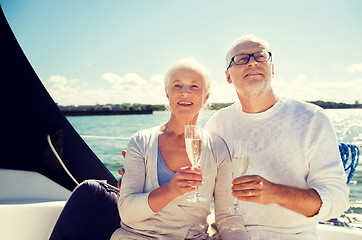 Image showing senior couple with glasses on sail boat or yacht