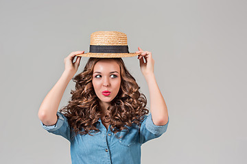 Image showing The girl in straw hat