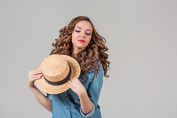 Image showing The girl in straw hat