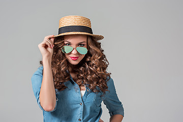 Image showing girl in sunglasses and straw
