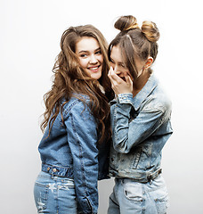 Image showing lifestyle and people concept: Fashion portrait of two stylish sexy girls best friends, over white background. Happy time for fun.