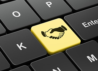 Image showing Finance concept: Handshake on computer keyboard background