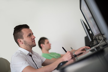 Image showing a group of graphic designers at work