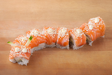 Image showing Closeup japanese sushi on wooden plate