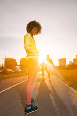 Image showing Portrait of sporty young african american woman running outdoors