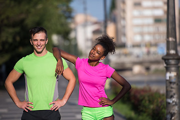 Image showing portrait of young multietnic jogging couple ready to run