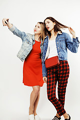 Image showing best friends teenage girls together having fun, posing emotional on white background, besties happy smiling, lifestyle people concept