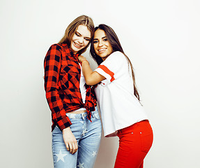 Image showing best friends teenage girls together having fun, posing emotional on white background, besties happy smiling, lifestyle people concept, blond and brunette multi nations