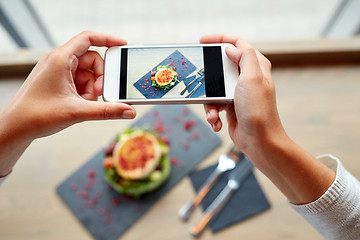 Image showing hands with smartphone photographing food