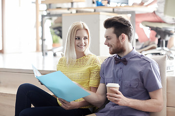 Image showing office workers with folder and coffee