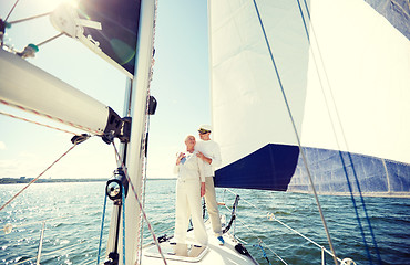 Image showing senior couple hugging on sail boat or yacht in sea