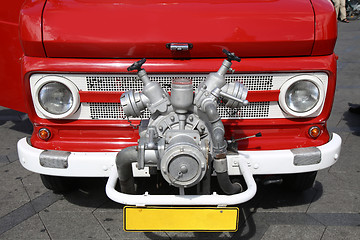 Image showing Old vintage fire truck with pumps and pipes