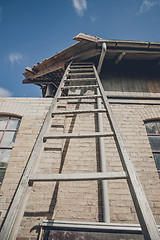 Image showing Tall ladder at an old building