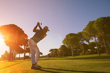 Image showing golf player hitting shot with club