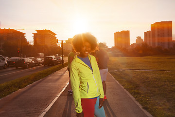 Image showing Portrait of sporty young african american woman running outdoors