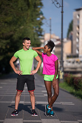 Image showing portrait of young multietnic jogging couple ready to run