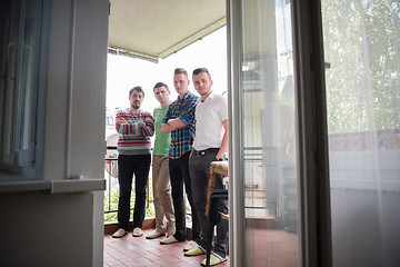 Image showing group of people standing at balcony