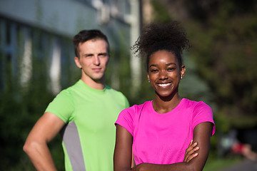 Image showing portrait of young multietnic jogging couple ready to run