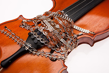 Image showing Golden Bracelets And Violin