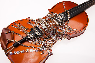 Image showing Golden Bracelets And Violin