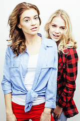 Image showing two pretty blond woman having fun together on white background, mature mother and young teenage daughter, lifestyle people concept