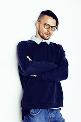 Image showing handsome middle age hipster man with modern hairstyle and tattoo, beard, close up on white background