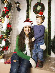 Image showing happy smiling family on Christmas at house with gifts, young mot