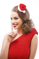 Image showing young pretty happy smiling brunette woman on christmas in santas