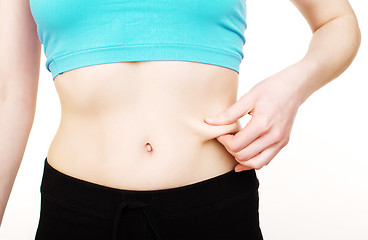 Image showing girls stomach measuring with tape isolated on white background, skiny woman on diet, healthcare people concept