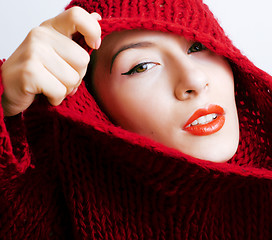 Image showing young pretty woman in sweater and scarf all over her face, lifes