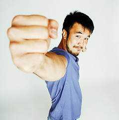 Image showing young cute asian man on white background gesturing emotional, po