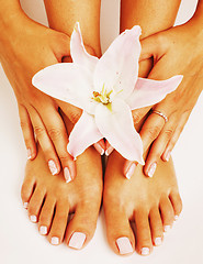 Image showing manicure pedicure with flower lily close up isolated on white pe