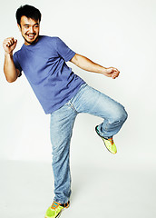 Image showing young cute asian man on white background gesturing emotional, po